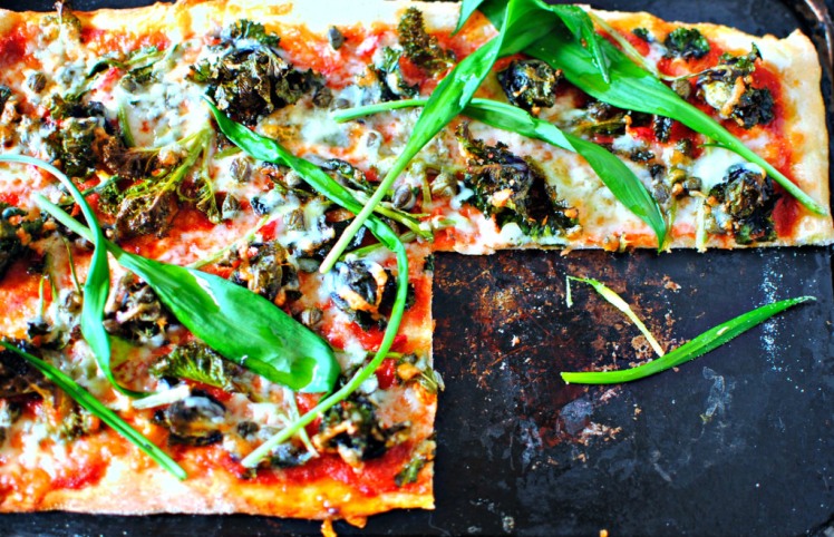 wild garlic pizza with kale tops , capers and chilli by food to glow